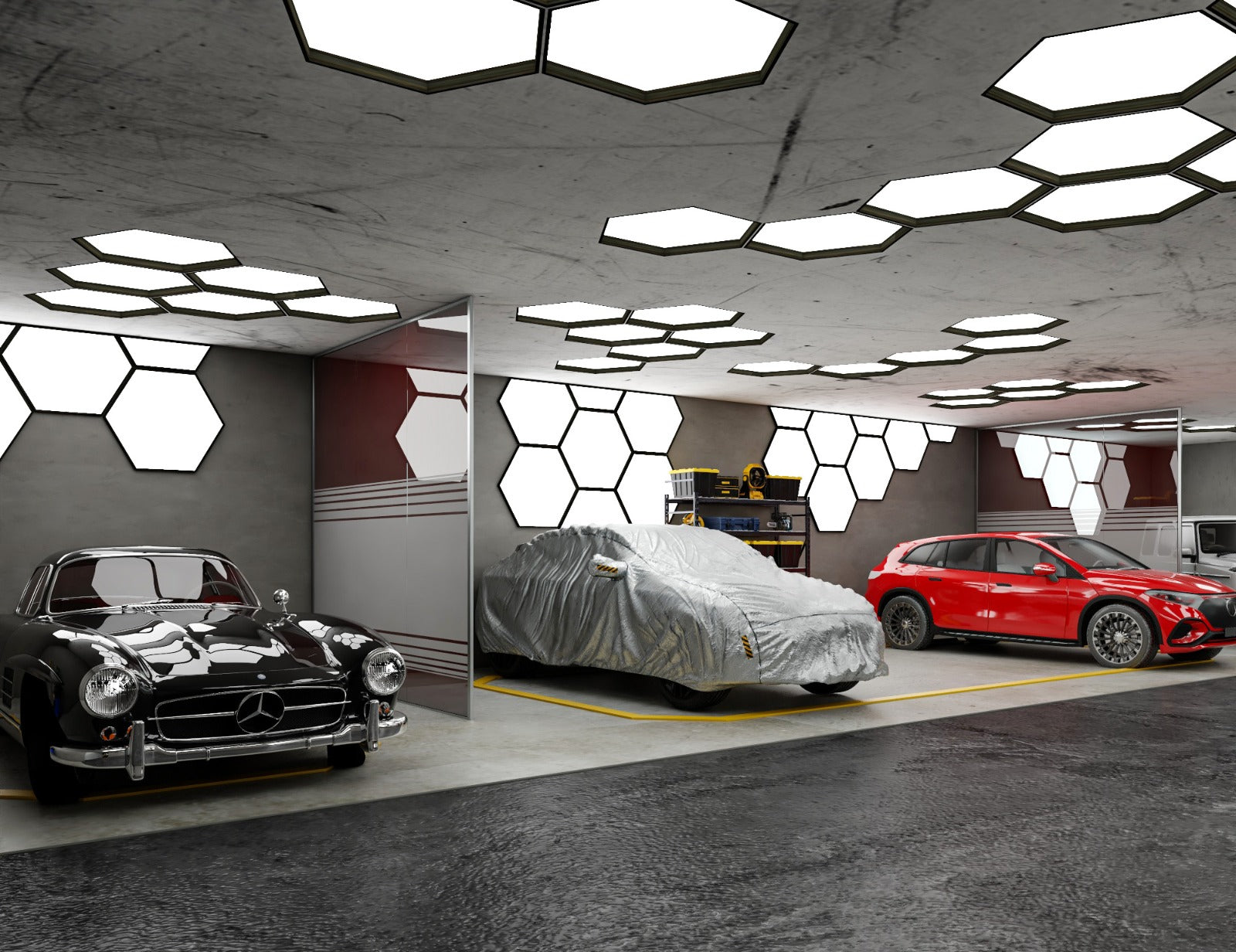 Modern car showroom with three cars: a black classic car, a silver covered car, and a red sports car.