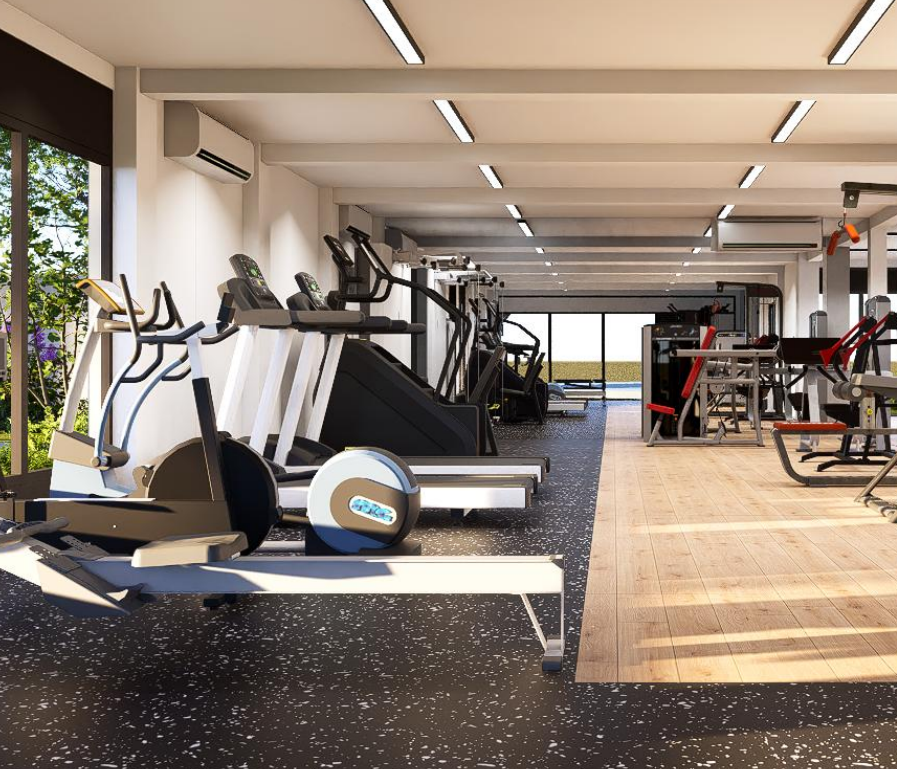 A modern indoor gym with cardio equipment including treadmills, ellipticals, and a stair climber on a black speckled floor, alongside a wood-look floor section and other exercise machines in the background.